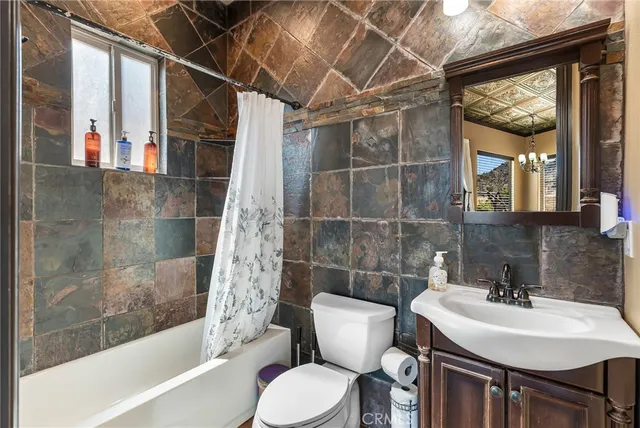 a view of a backyard with wooden fence