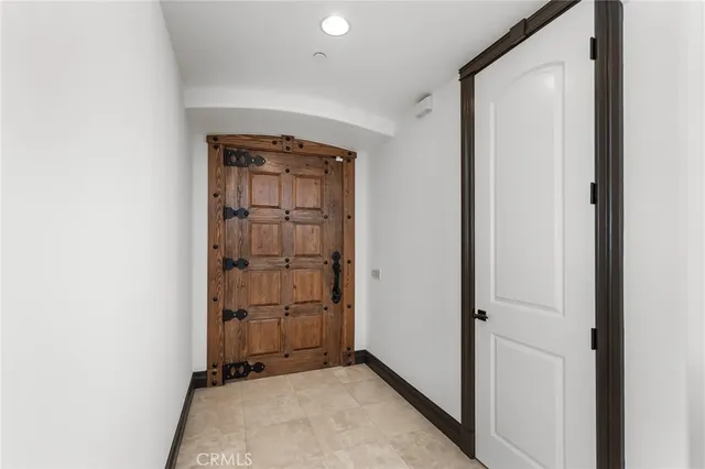 a living room with furniture and a clock