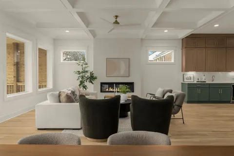 a kitchen with a sink stainless steel appliances a counter space and cabinets