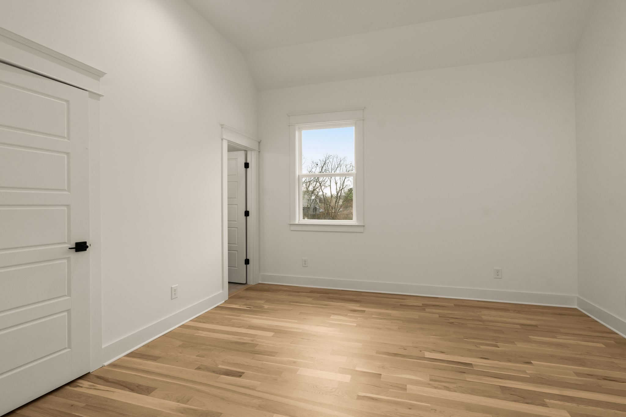 2512 Sheridan Road Nashville, TN 37206 - Photo 28 of 45 a view of an empty room with wooden floor and a window