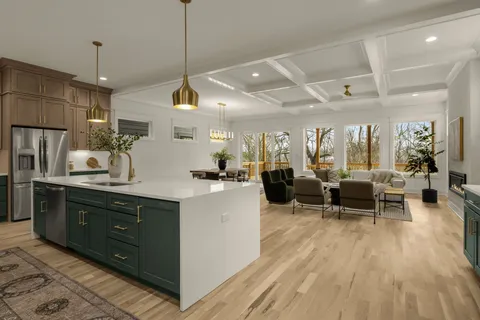 a living room with fireplace furniture and a wooden floor