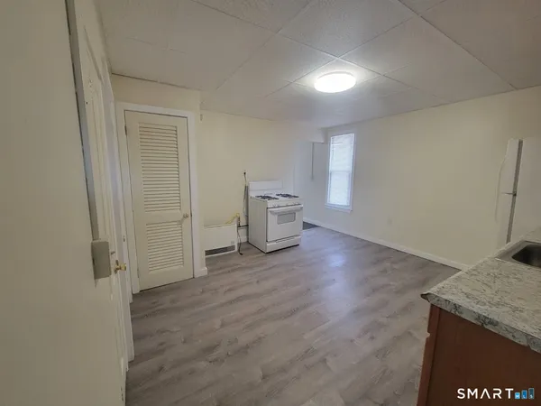 a view of a kitchen cabinets and wooden floor