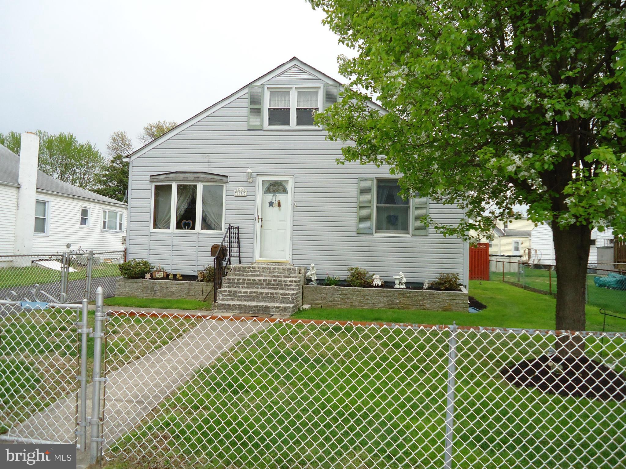 13 German Hill Road Baltimore, MD 21222 - Photo 1 of 15 a front view of a house with a garden