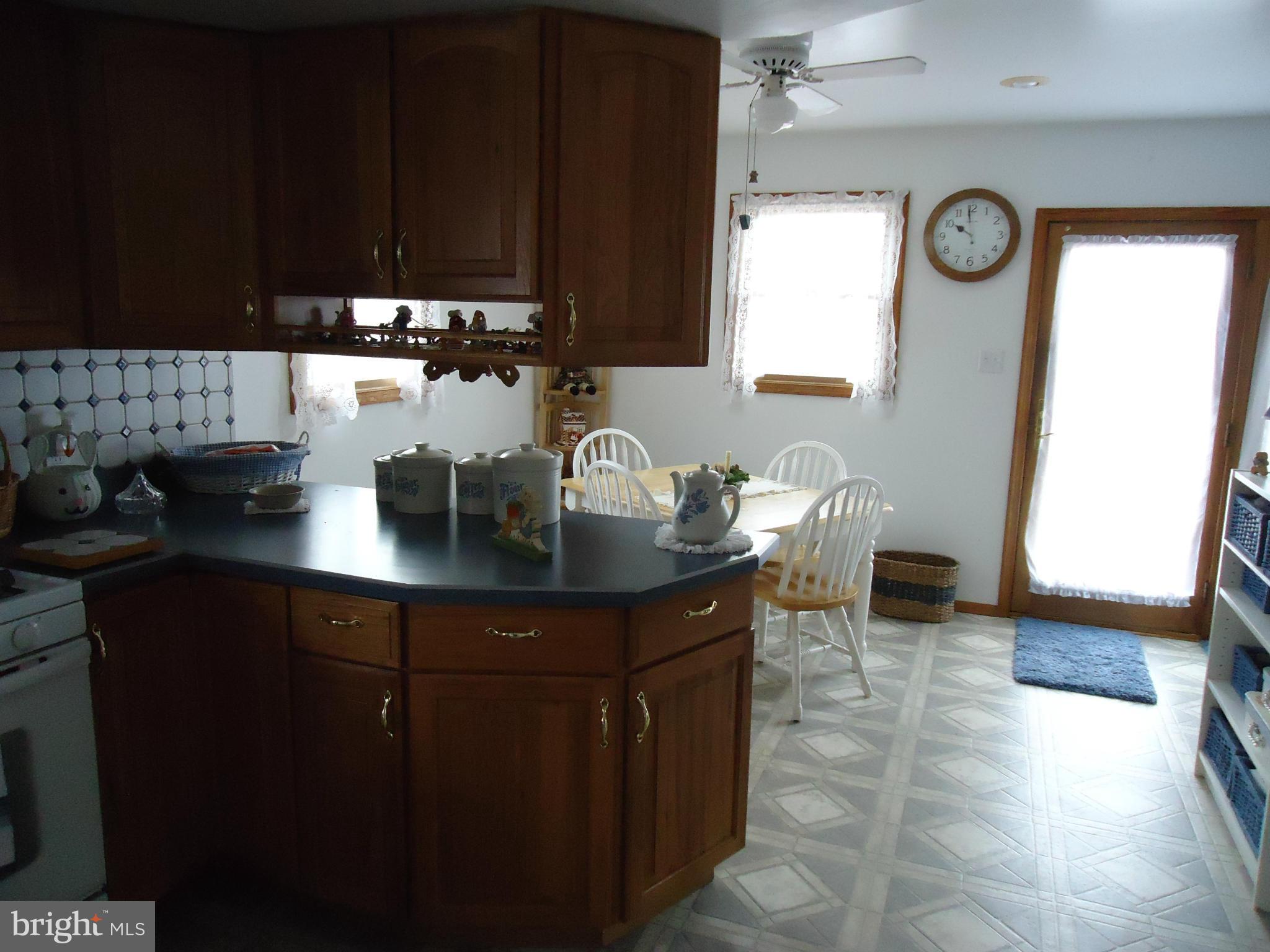 13 German Hill Road Baltimore, MD 21222 - Photo 11 of 15 a kitchen with a sink cabinets and a window