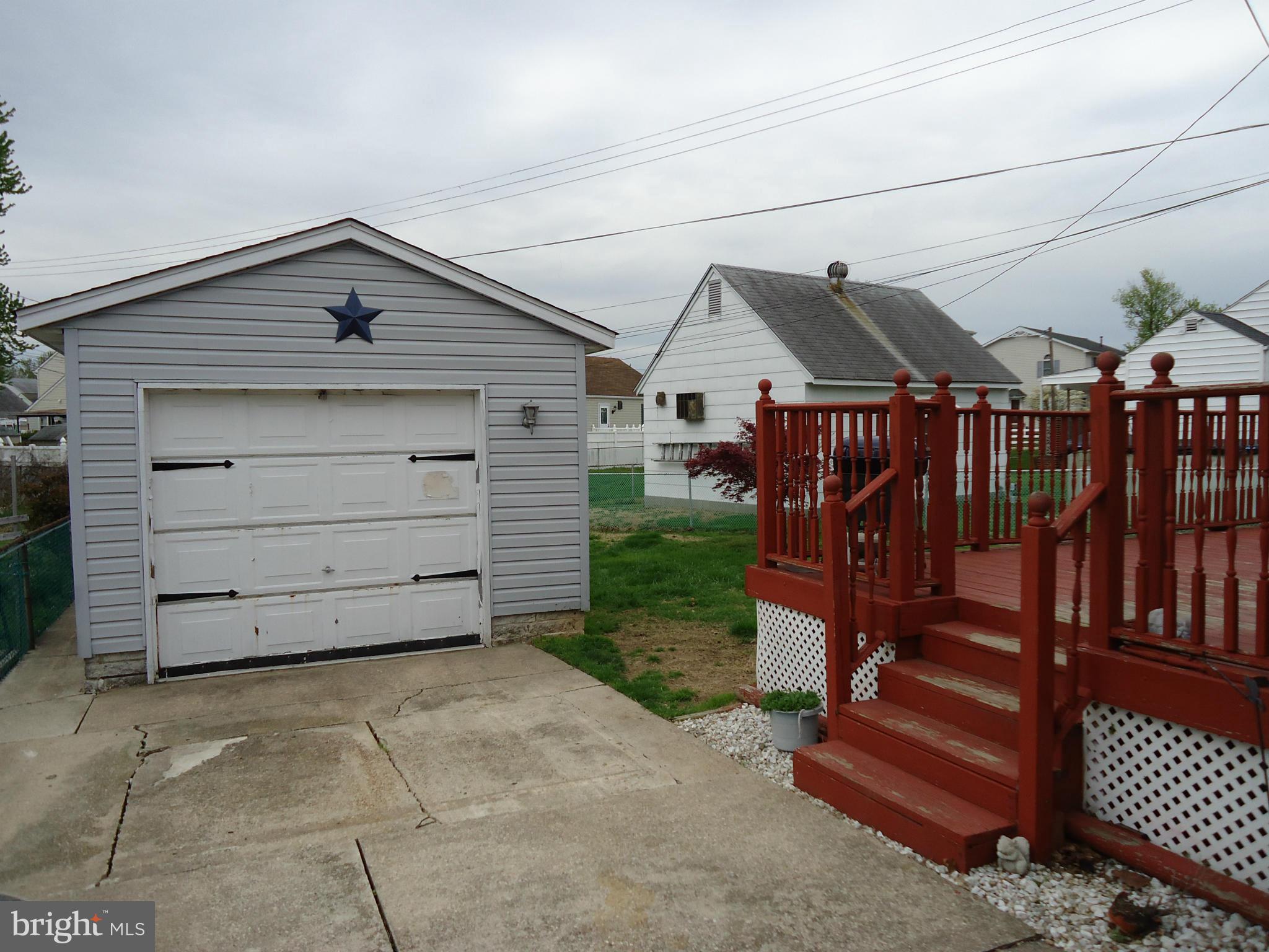 13 German Hill Road Baltimore, MD 21222 - Photo 14 of 15 a view of a wooden house with a small yard and wooden fence