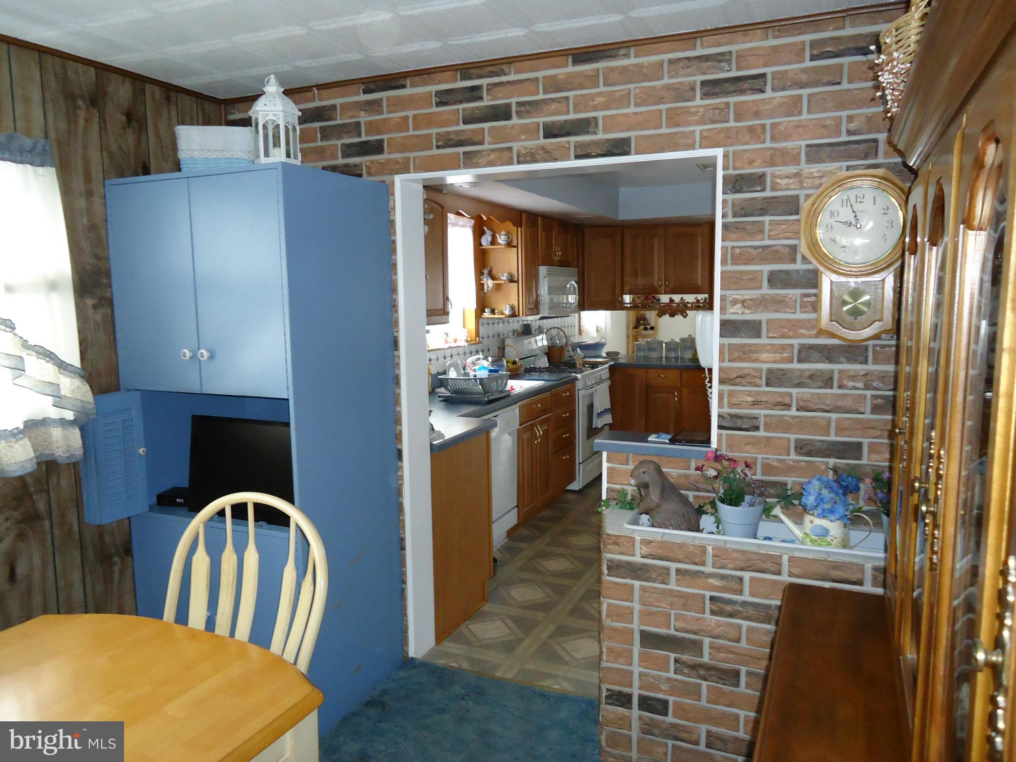 13 German Hill Road Baltimore, MD 21222 - Photo 9 of 15 a kitchen with a refrigerator and a stove