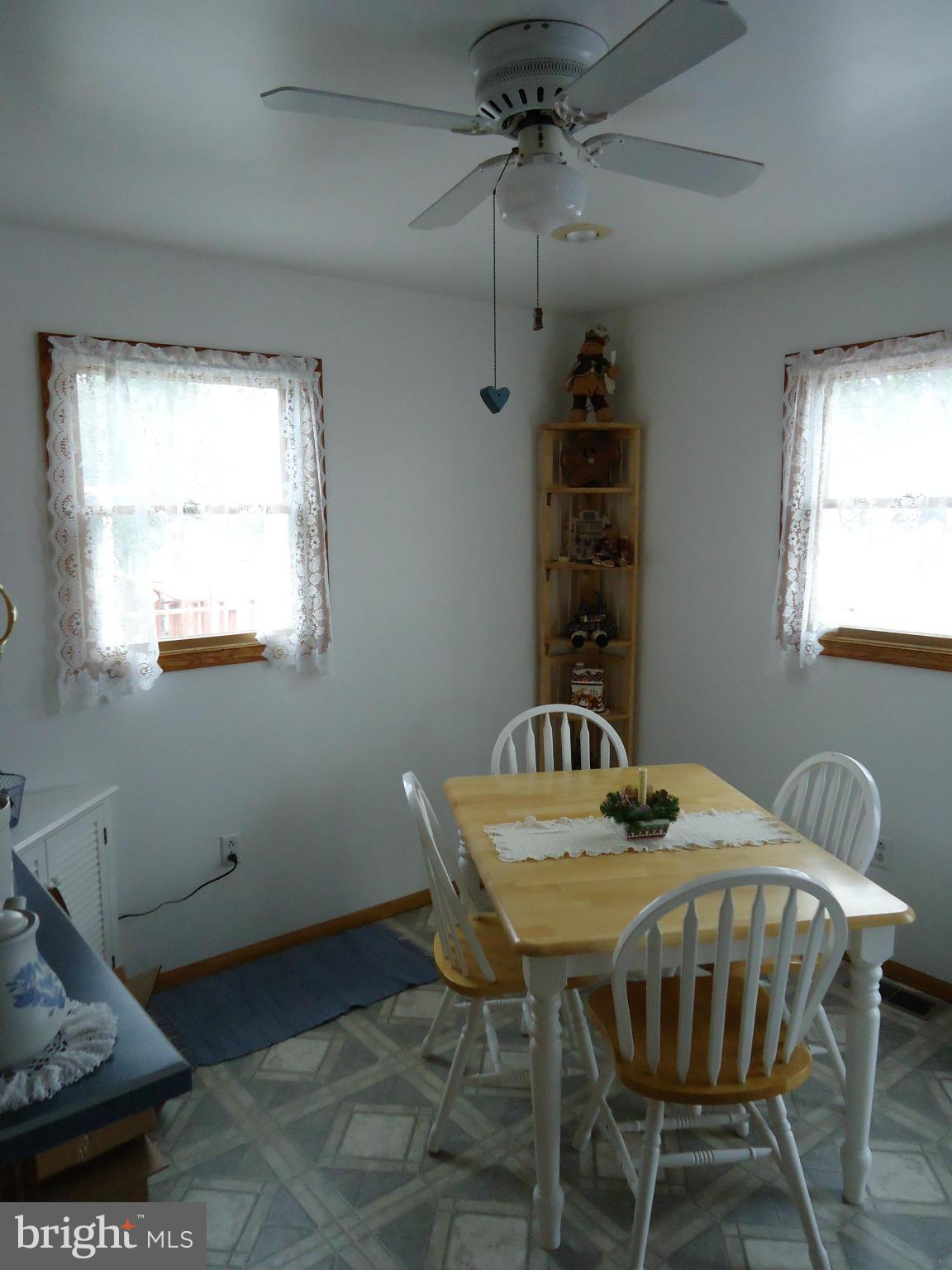 13 German Hill Road Baltimore, MD 21222 - Photo 10 of 15 a dining room with a table chairs and a window