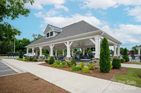 a front view of a house with garden and porch