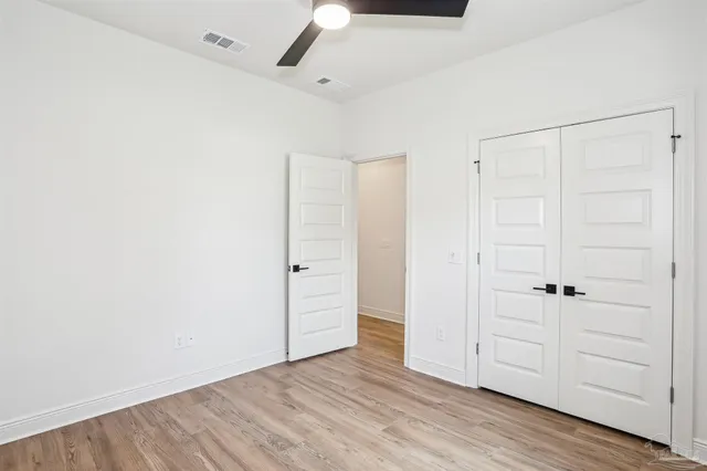 an empty room with wooden floor