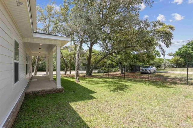 a view of a patio with swimming pool