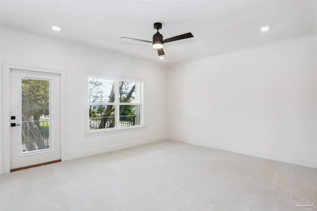 a view of room with window and ceiling fan