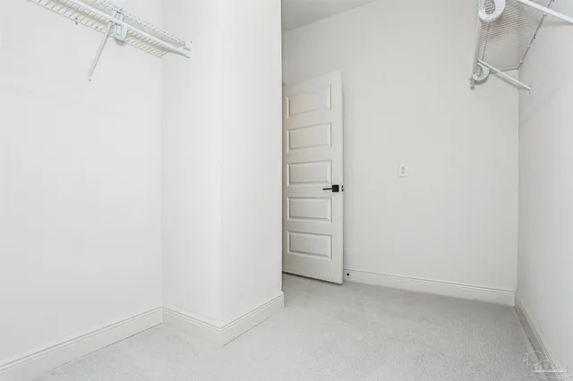 a view of an empty walk in closet