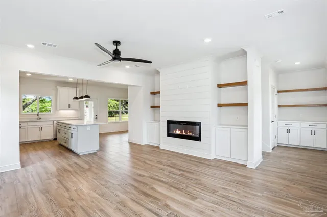 a kitchen with a refrigerator and a stove
