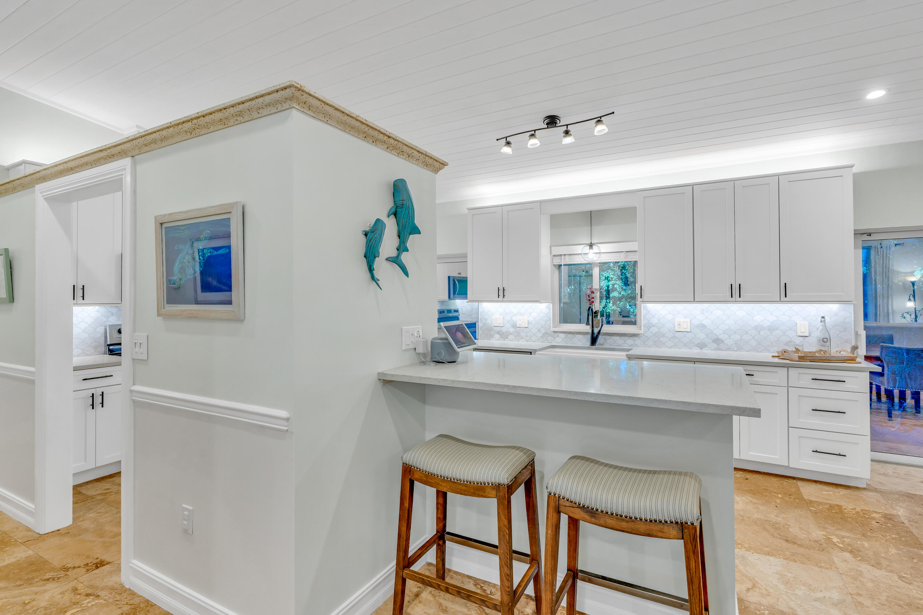 33 Blue Runner Street Key Largo, FL 33037 - Photo 16 of 60 a kitchen with a table and chairs