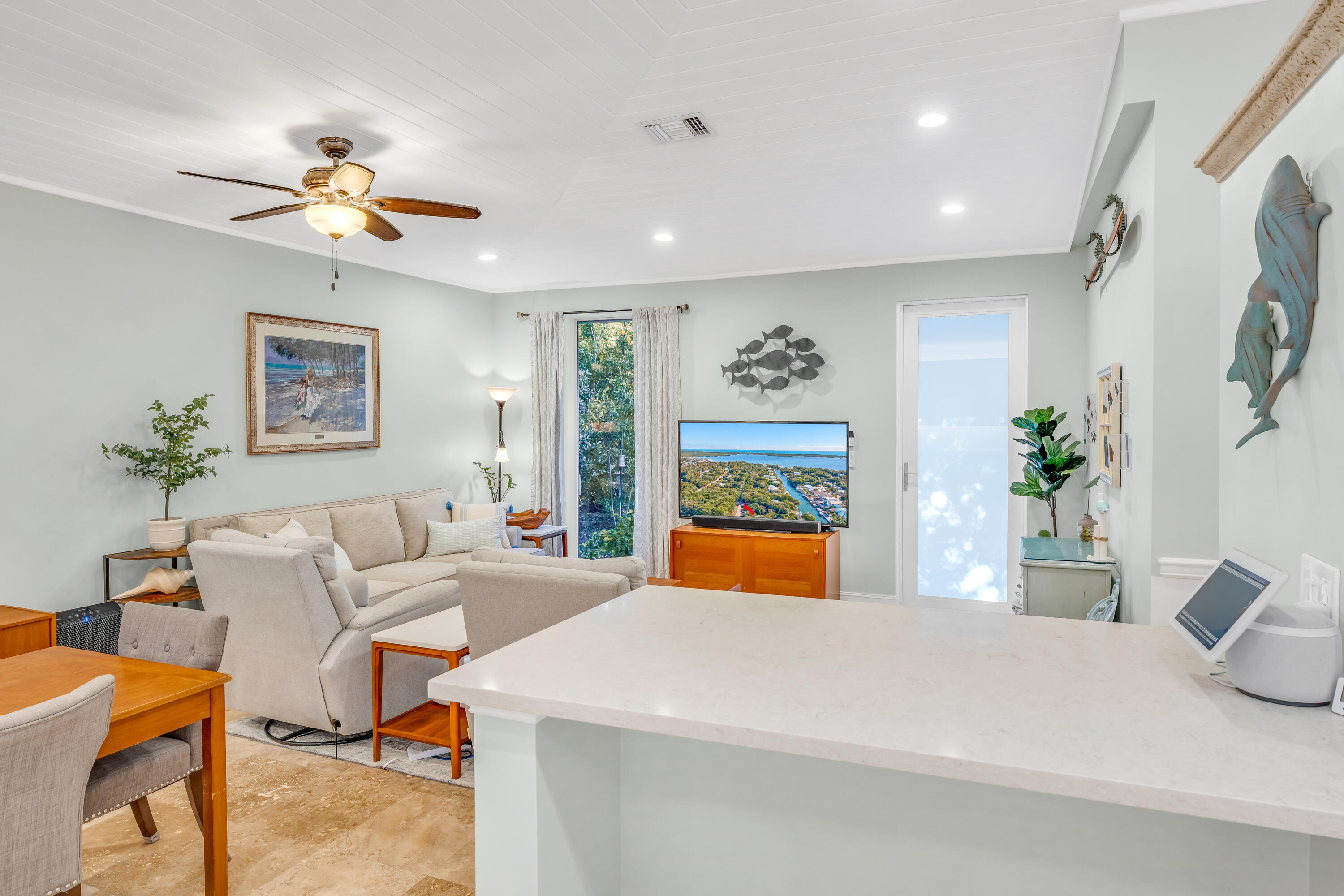 33 Blue Runner Street Key Largo, FL 33037 - Photo 17 of 60 a living room with furniture a chandelier and a window