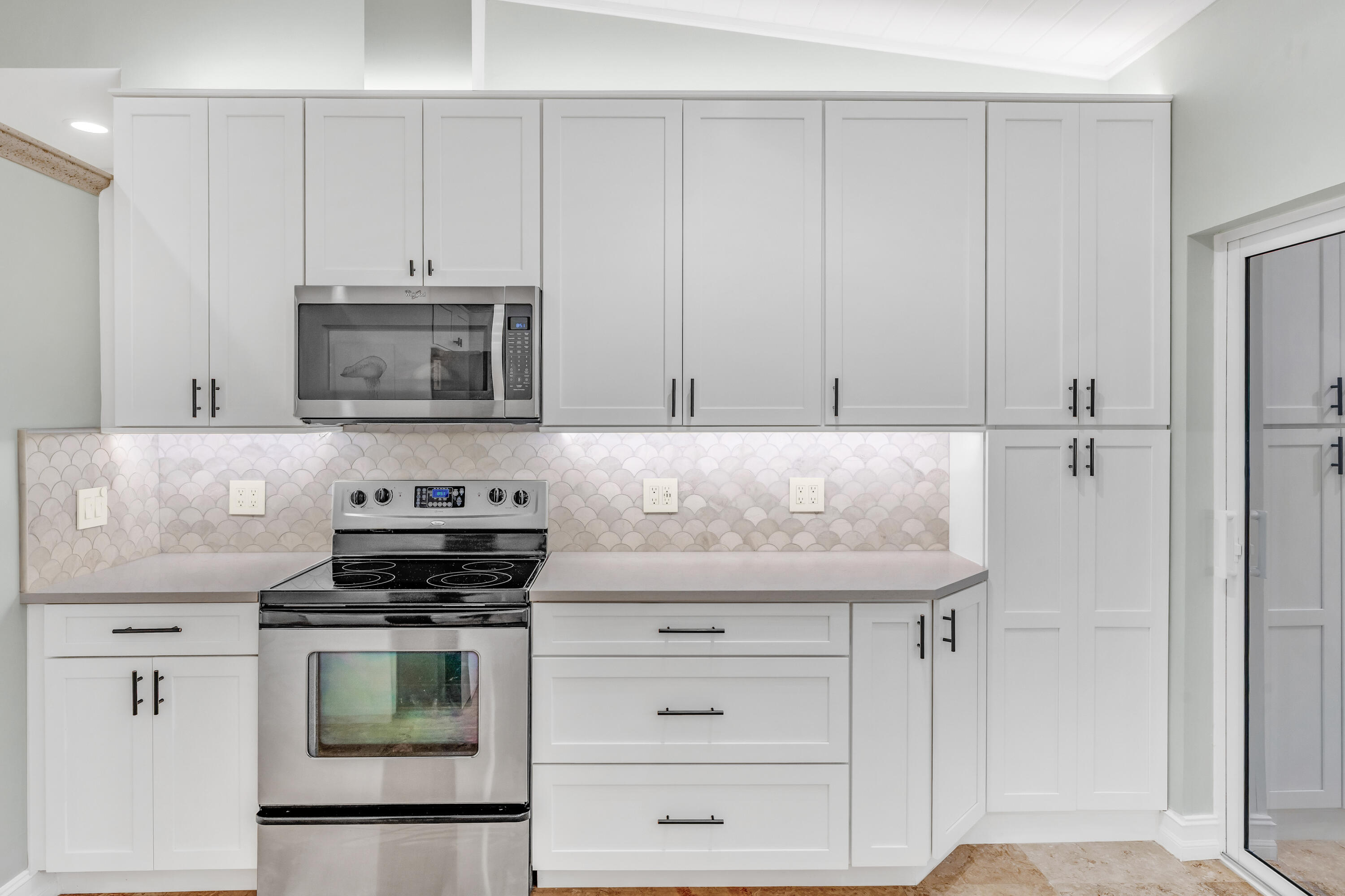 33 Blue Runner Street Key Largo, FL 33037 - Photo 20 of 60 a kitchen with granite countertop white cabinets and stainless steel appliances