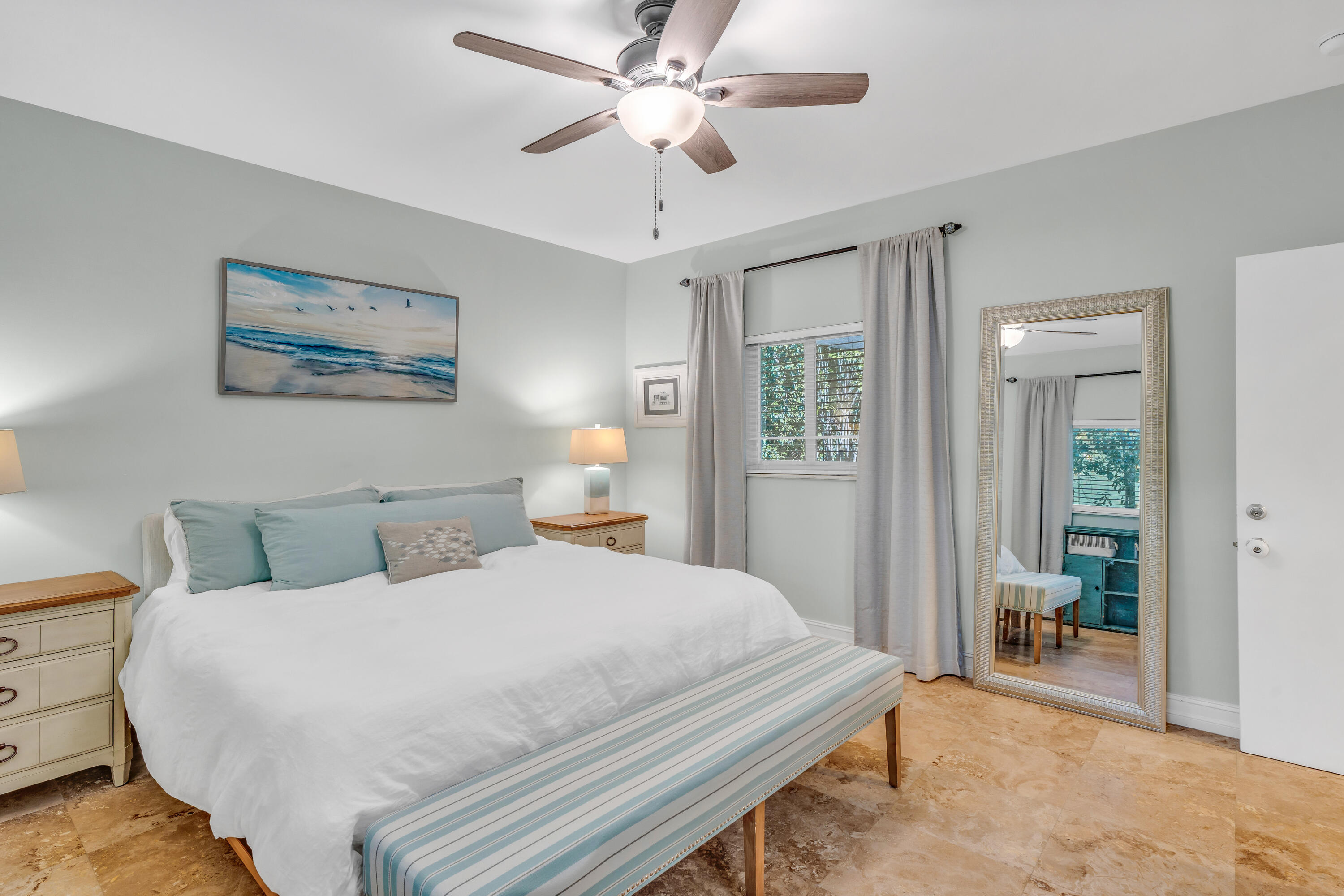 33 Blue Runner Street Key Largo, FL 33037 - Photo 22 of 60 a bedroom with a large bed and a chandelier