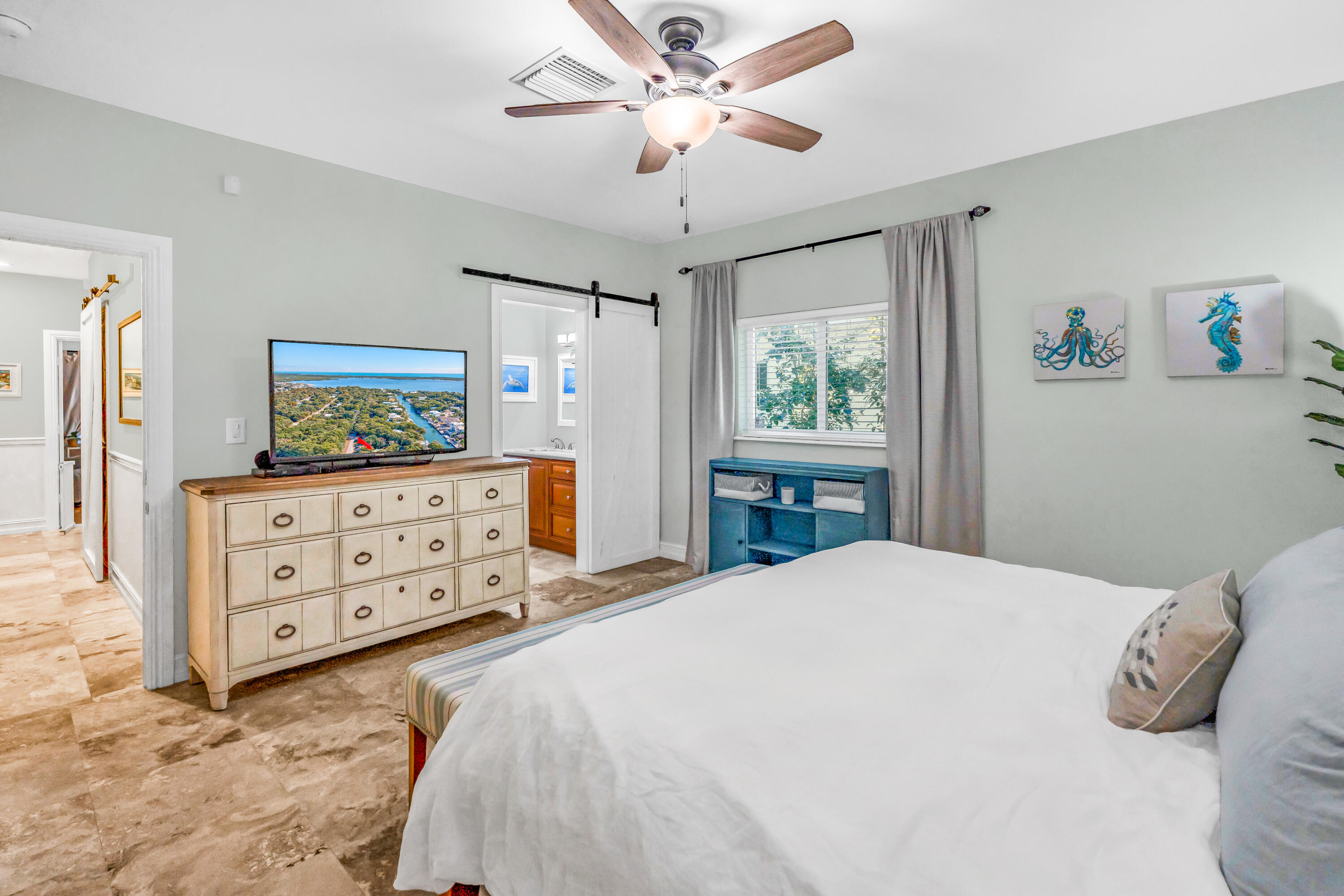 33 Blue Runner Street Key Largo, FL 33037 - Photo 27 of 60 a bedroom with a bed a window and a dresser