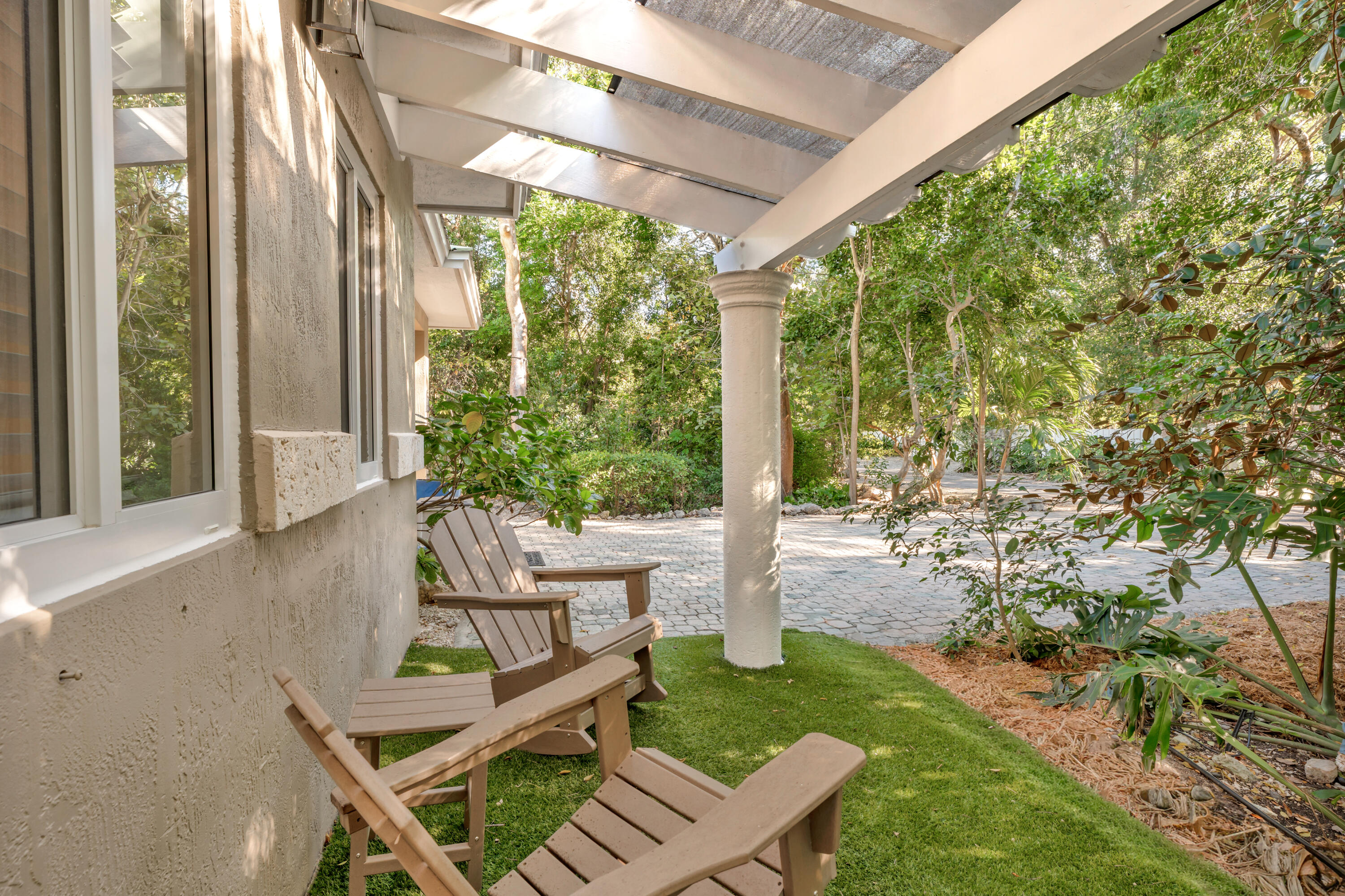 33 Blue Runner Street Key Largo, FL 33037 - Photo 3 of 60 a view of an outdoor sitting area with golf course