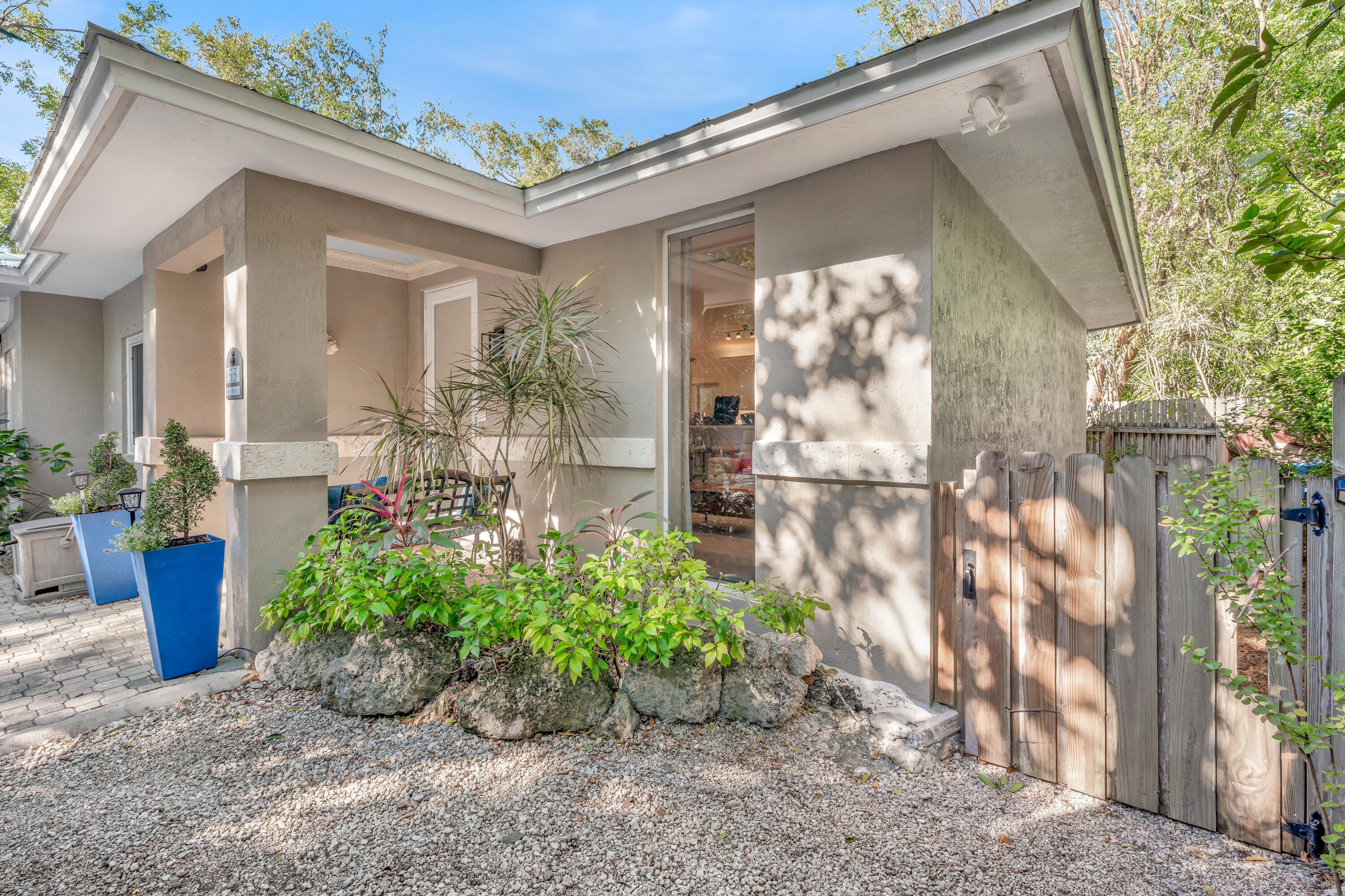 33 Blue Runner Street Key Largo, FL 33037 - Photo 4 of 60 a front view of a house with garden