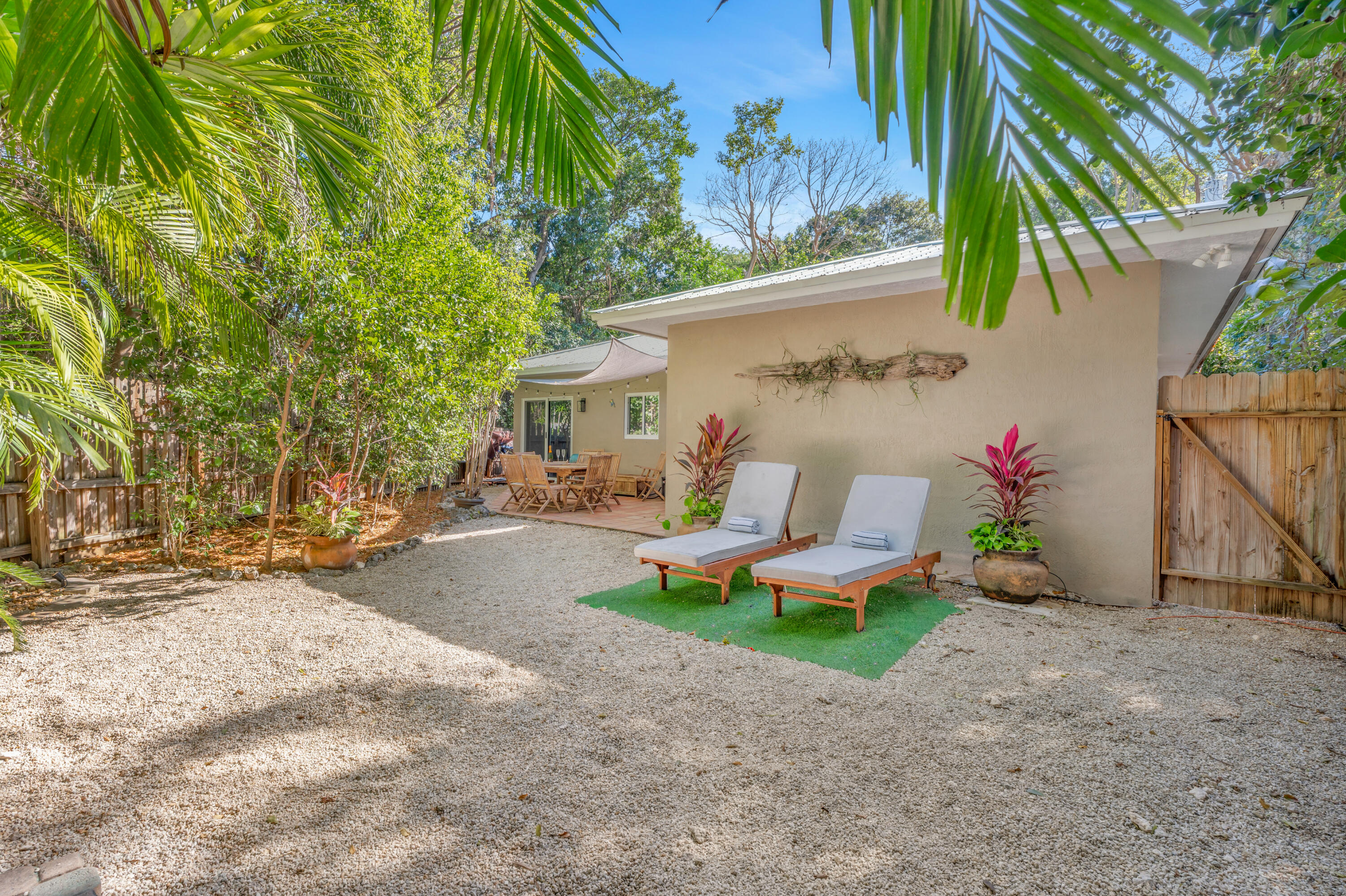 33 Blue Runner Street Key Largo, FL 33037 - Photo 43 of 60 a view of a chair and table in backyard