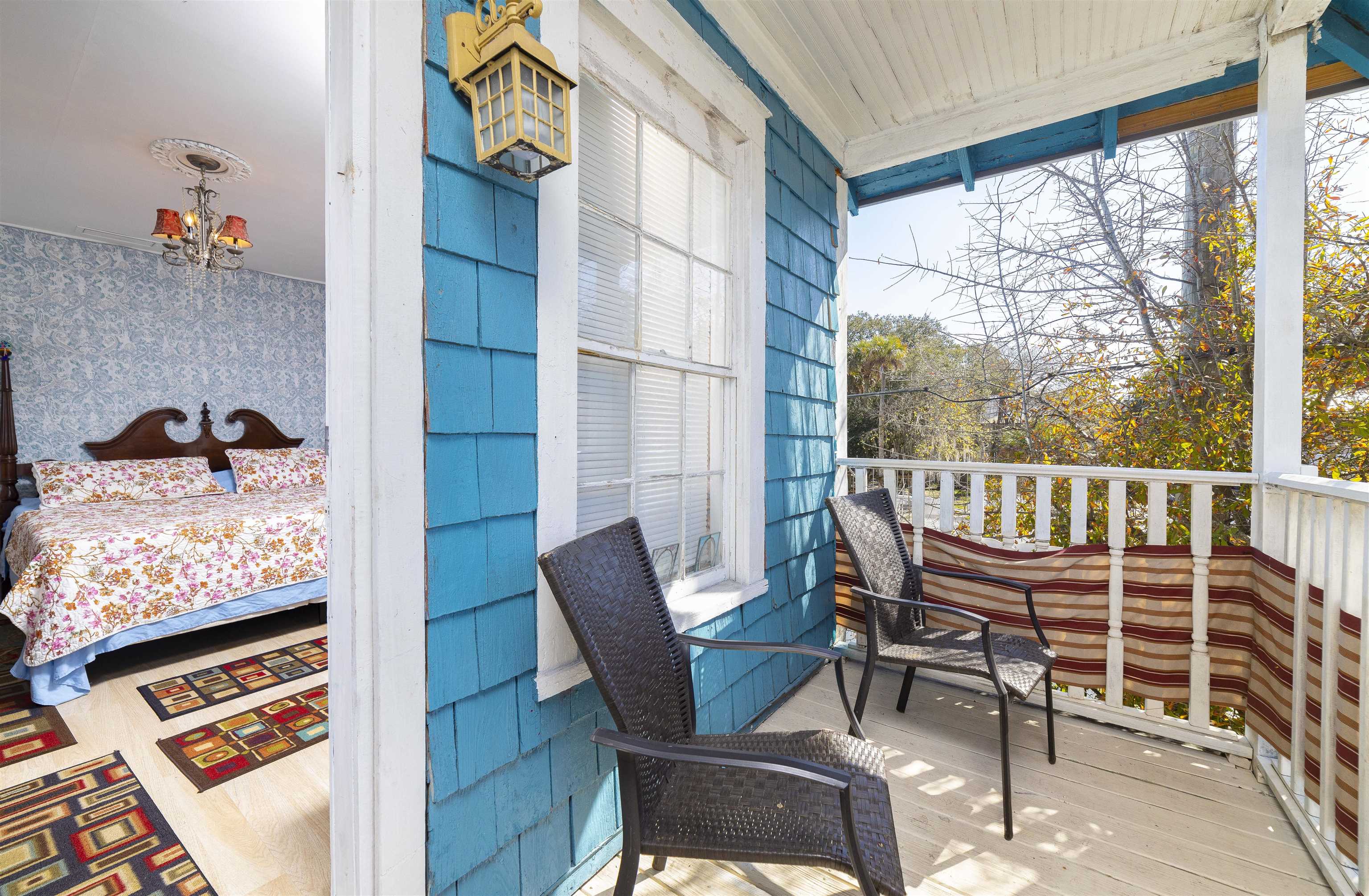 77 Oneida Street St. Augustine, FL 32084 - Photo 15 of 26 a view of a chairs and table in the balcony