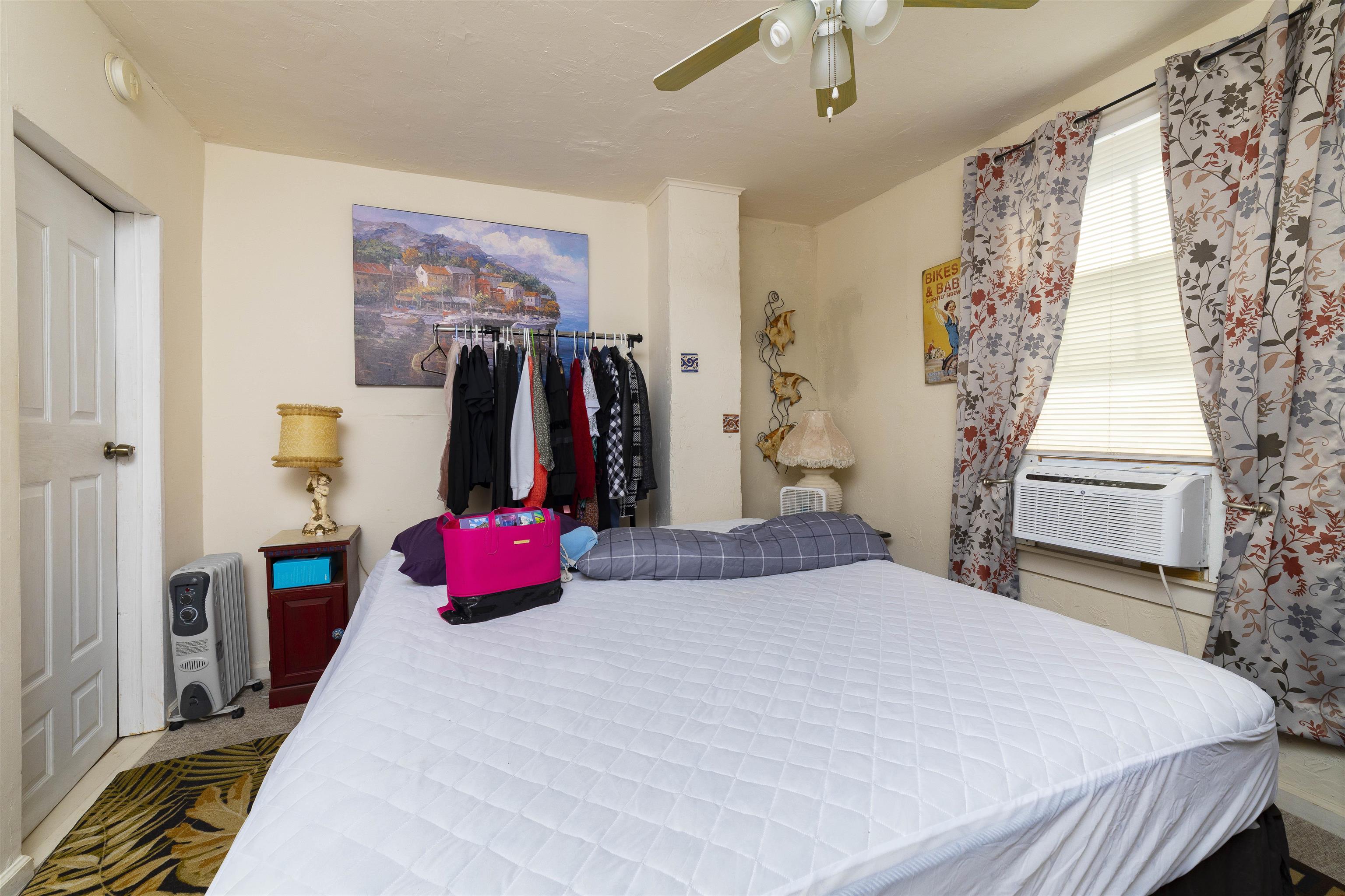 77 Oneida Street St. Augustine, FL 32084 - Photo 21 of 26 a bedroom with a bed and a walk in closet