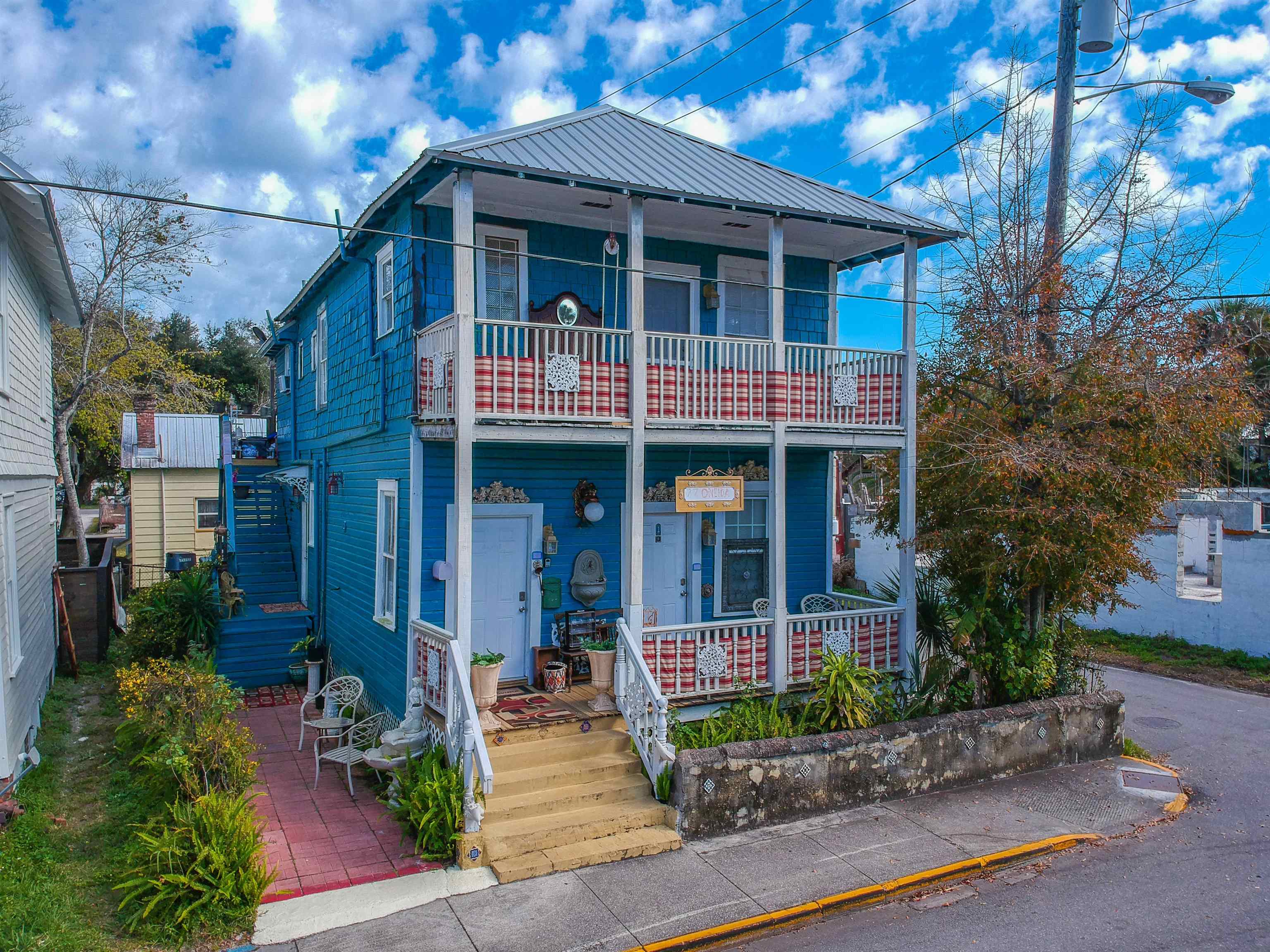 77 Oneida Street St. Augustine, FL 32084 - Photo 3 of 26 a view of a house with entrance and plants