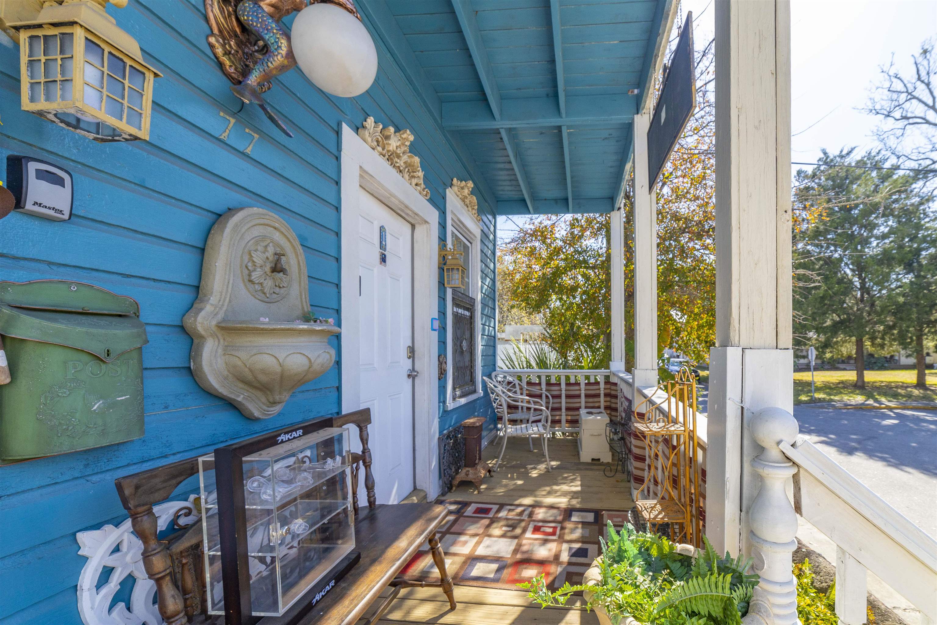 77 Oneida Street St. Augustine, FL 32084 - Photo 5 of 26 a front view of a house with garden