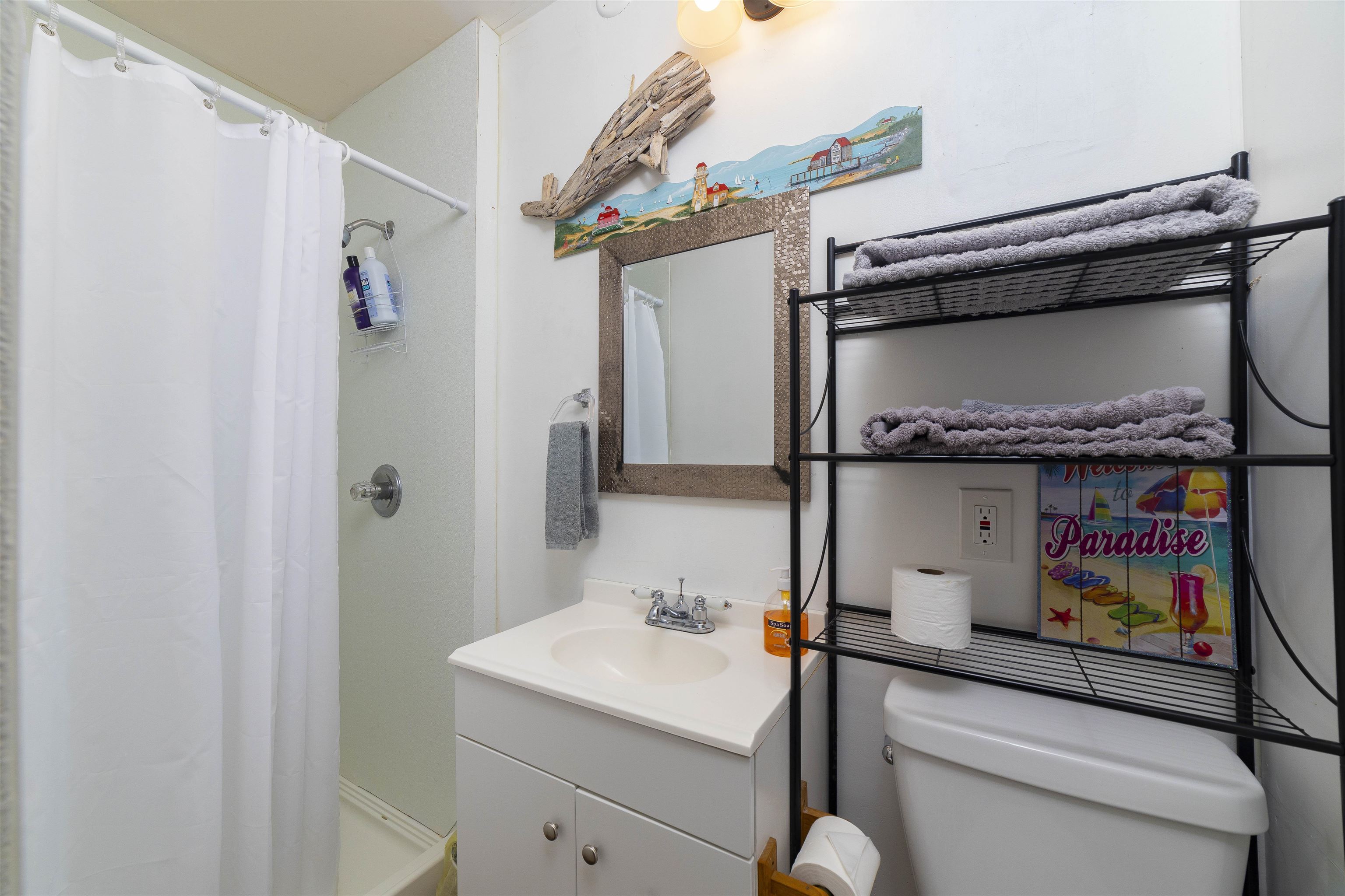77 Oneida Street St. Augustine, FL 32084 - Photo 10 of 26 a bathroom with a sink and a mirror