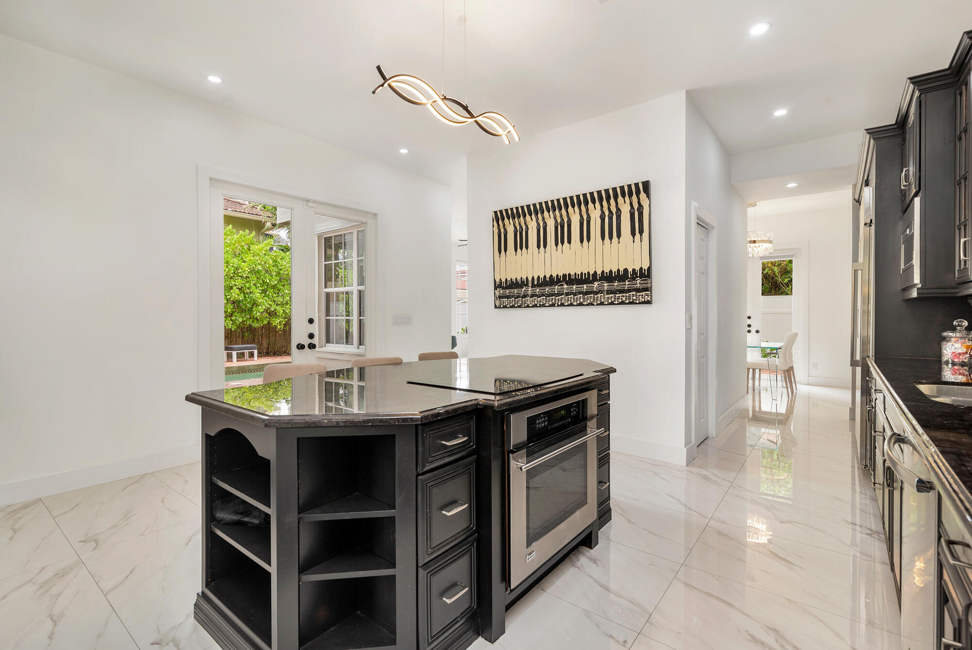 460 Surfside Lane Juno Beach, FL 33408 - Photo 11 of 51 a kitchen with stainless steel appliances granite countertop a stove and a sink