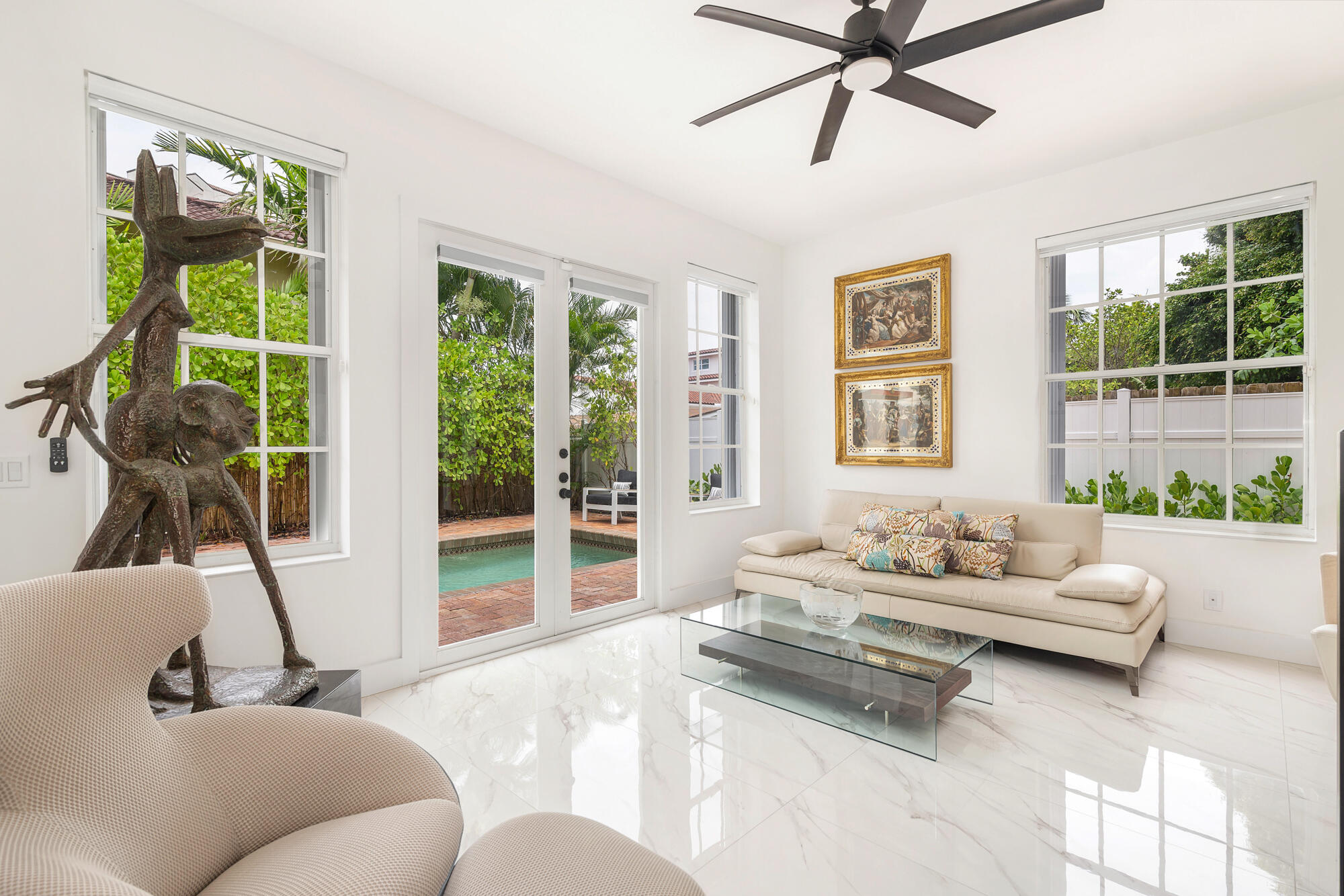 460 Surfside Lane Juno Beach, FL 33408 - Photo 14 of 51 a living room with furniture and a large window