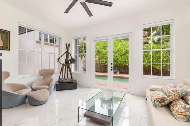 a view of a backyard with swimming pool