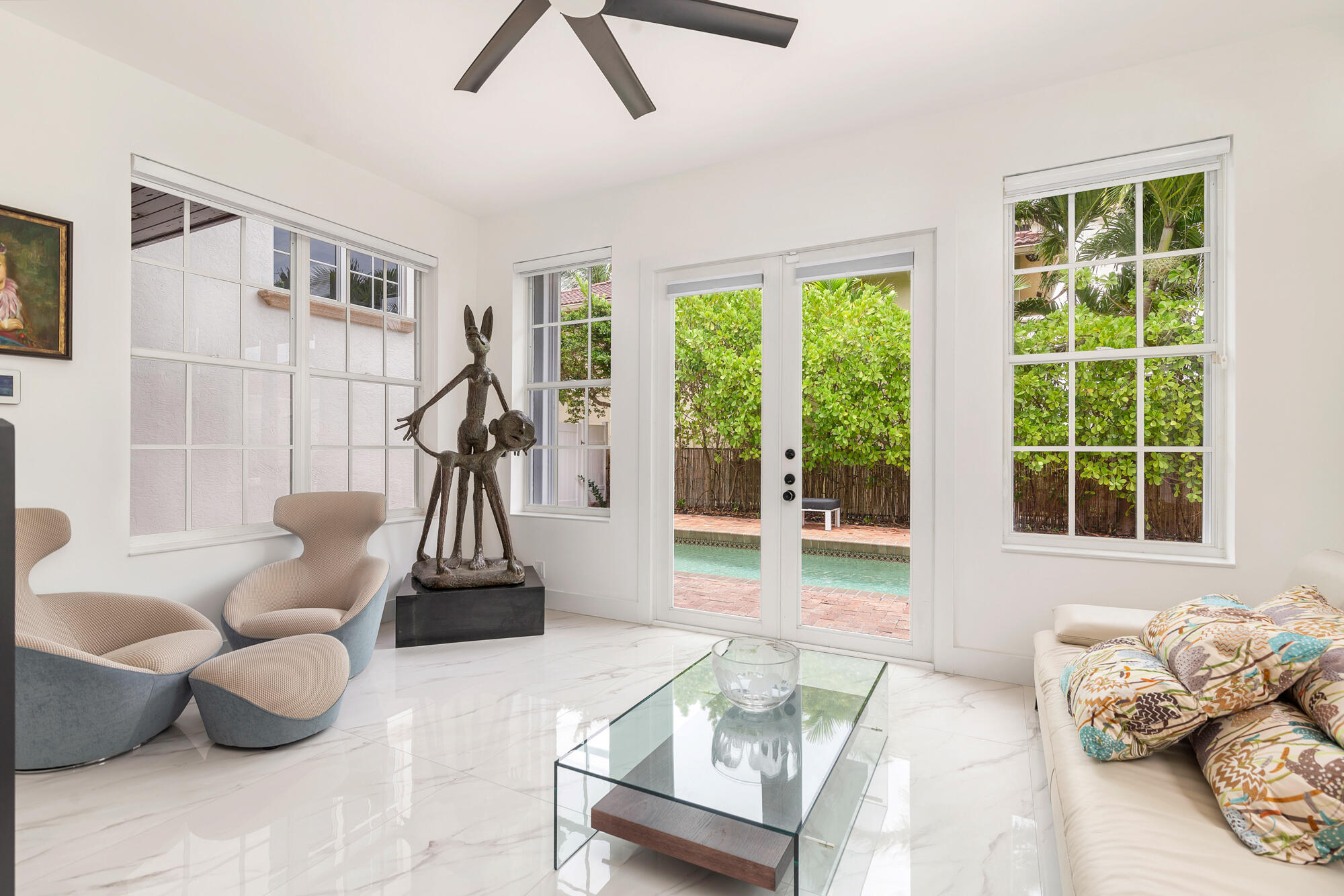 460 Surfside Lane Juno Beach, FL 33408 - Photo 15 of 51 a living room with furniture and a floor to ceiling window