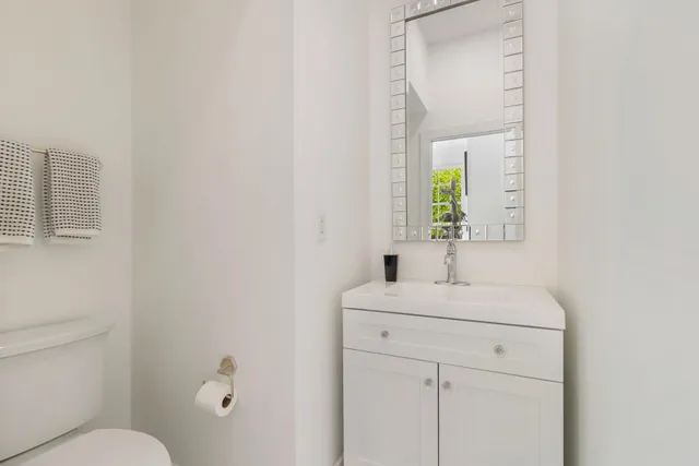 a living room with furniture and large windows