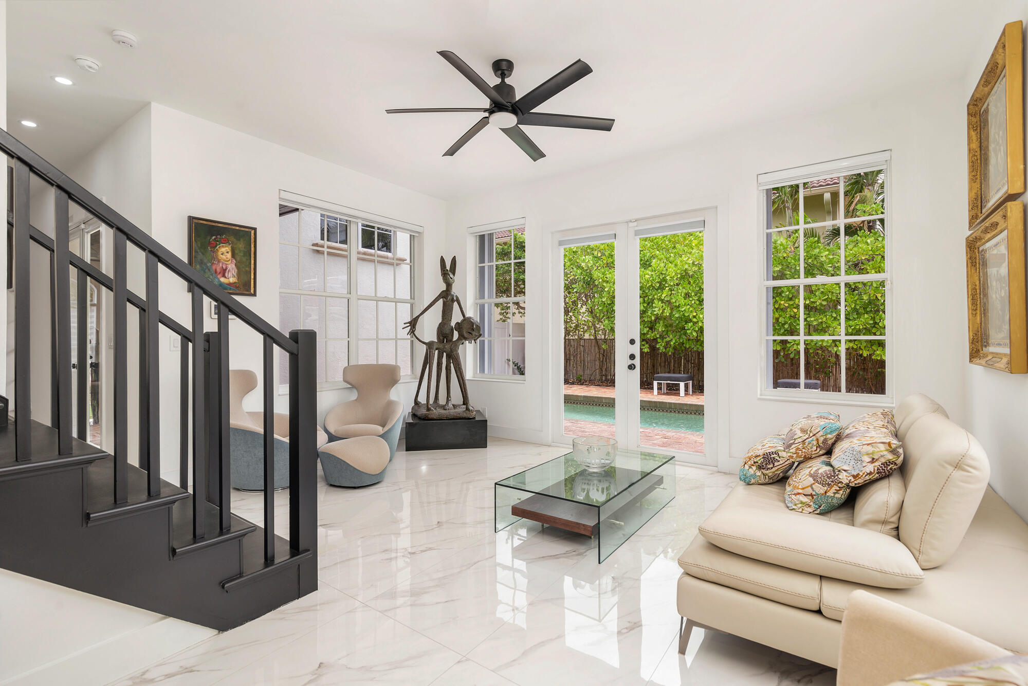 460 Surfside Lane Juno Beach, FL 33408 - Photo 19 of 51 a living room with furniture and large windows
