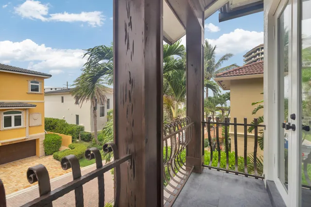 a bathroom with a granite countertop sink mirror bathtub and toilet