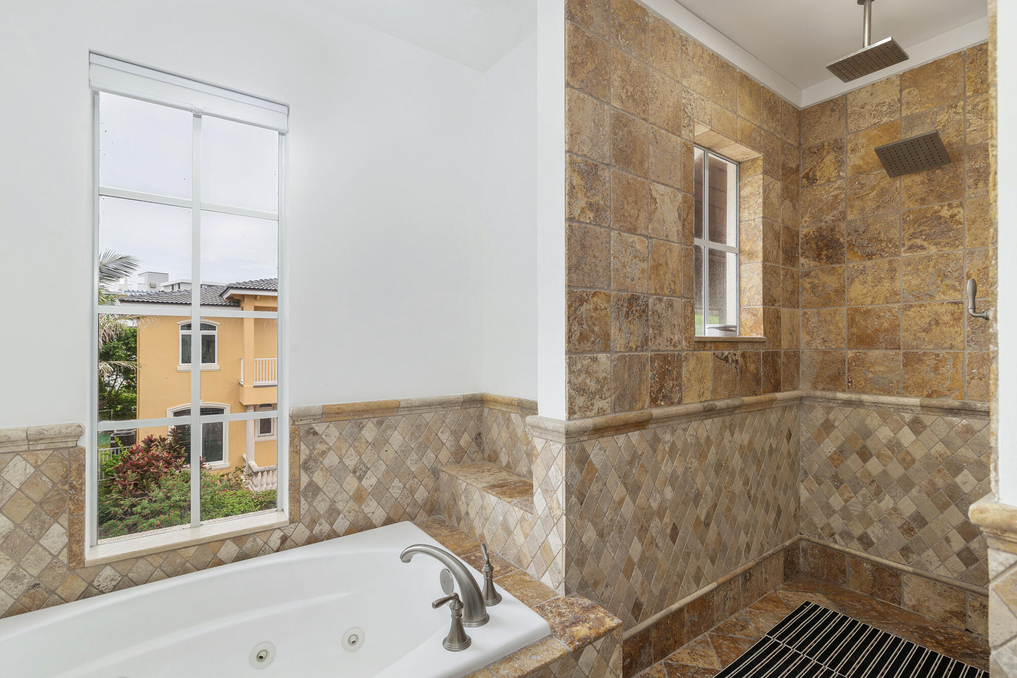 460 Surfside Lane Juno Beach, FL 33408 - Photo 23 of 51 a bathroom with a bathtub and a shower