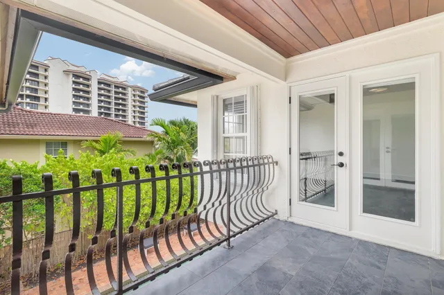 a spacious bathroom with a granite countertop sink mirror and toilet