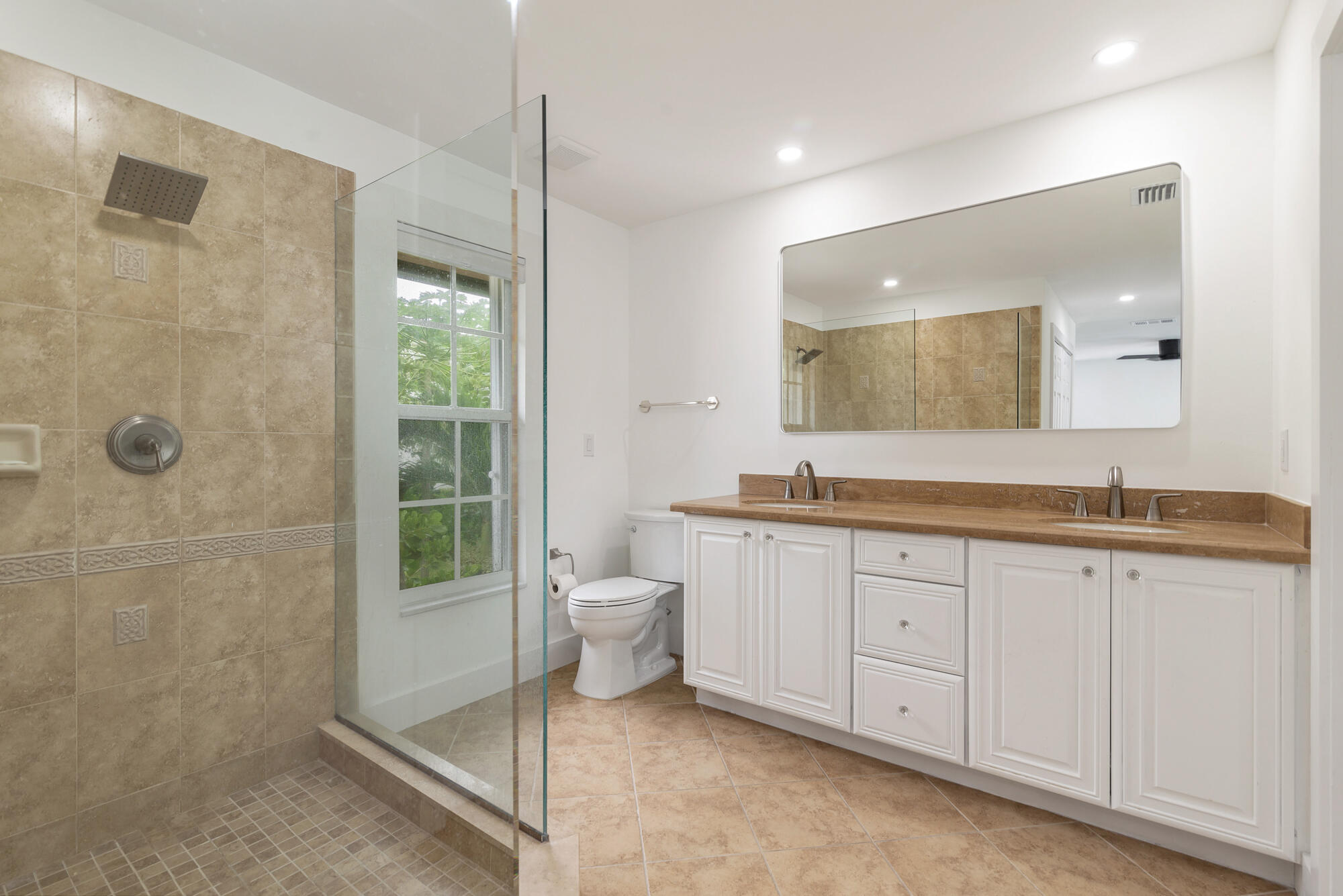 460 Surfside Lane Juno Beach, FL 33408 - Photo 26 of 51 a spacious bathroom with a granite countertop sink mirror and toilet