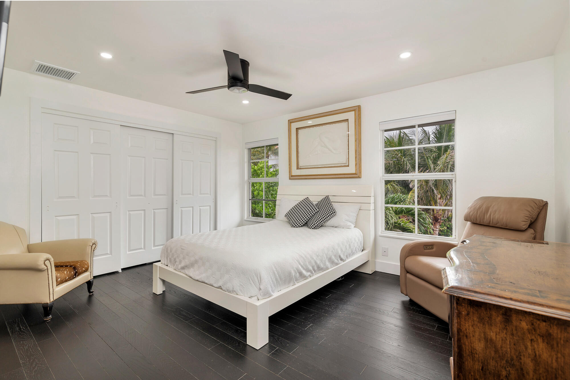 460 Surfside Lane Juno Beach, FL 33408 - Photo 28 of 51 a spacious bedroom with a bed and wooden floor