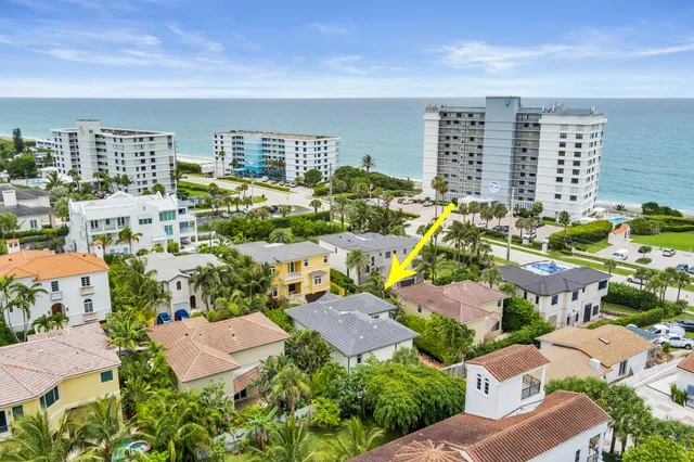 an aerial view of residential houses with outdoor space