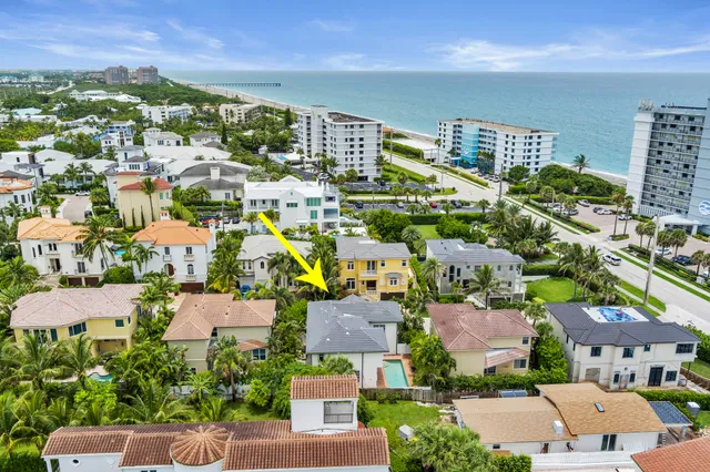 an aerial view of house with yard and a yard