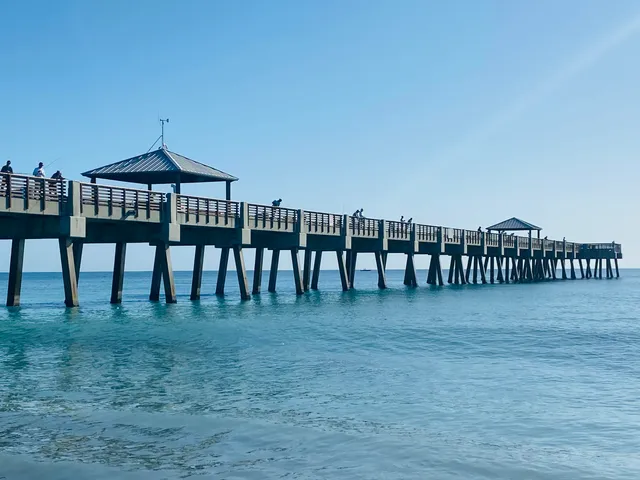 a view of ocean with a bench