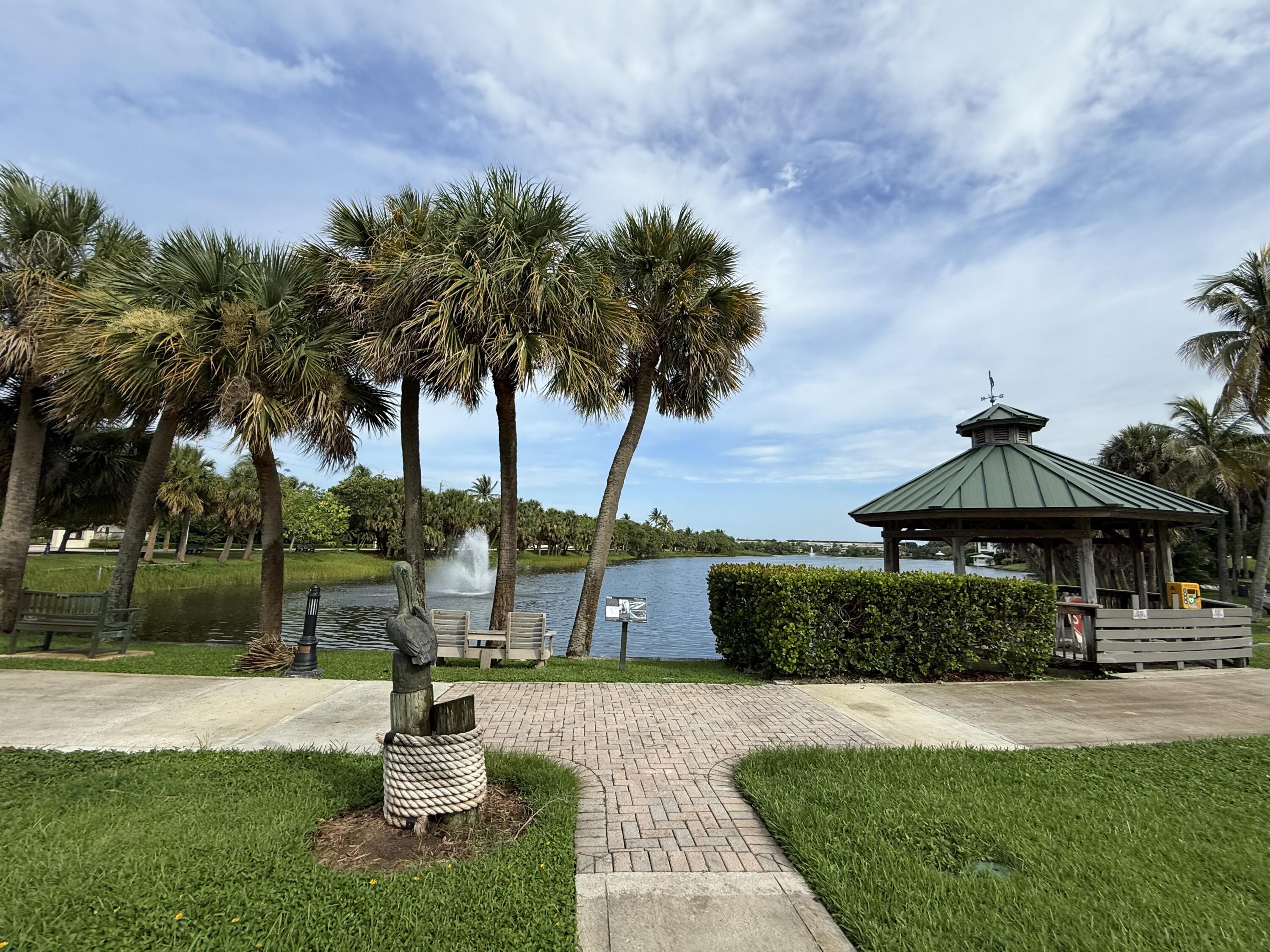 460 Surfside Lane Juno Beach, FL 33408 - Photo 46 of 51 a front view of a house with garden