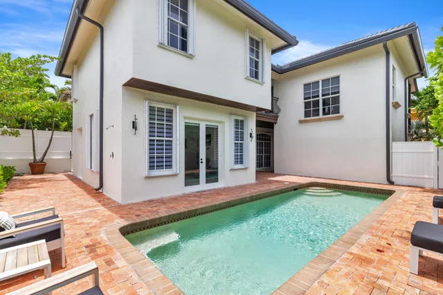 a view of a chairs and table in the patio