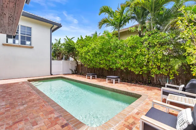 a kitchen with lots of counter top space and stainless steel appliances