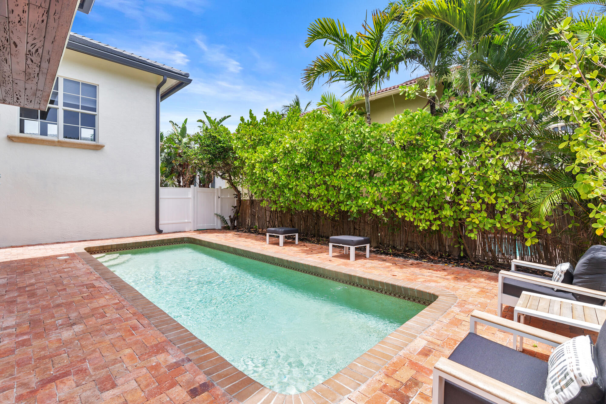 460 Surfside Lane Juno Beach, FL 33408 - Photo 7 of 51 a view of a chairs and table in the patio