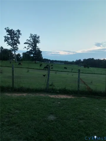 a view of a yard with swimming pool