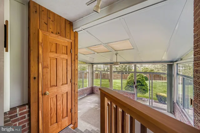 a view of a porch with wooden floor and outdoor space